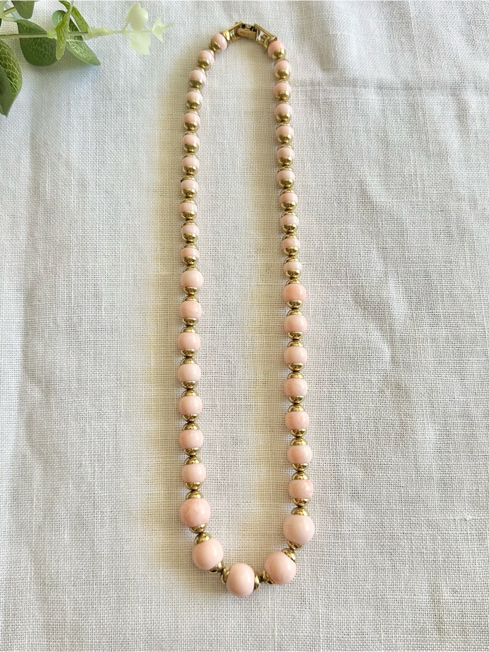Vintage Avon pink and gold-toned bead necklace